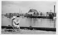 Ruth Haviland Sutton sketching from the lawn/bulkhead at the Easy Street Gallery, 1940s, photo from a postcard