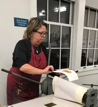 Mary Emery in the AAN print studio -  - photo by Robert Frazier